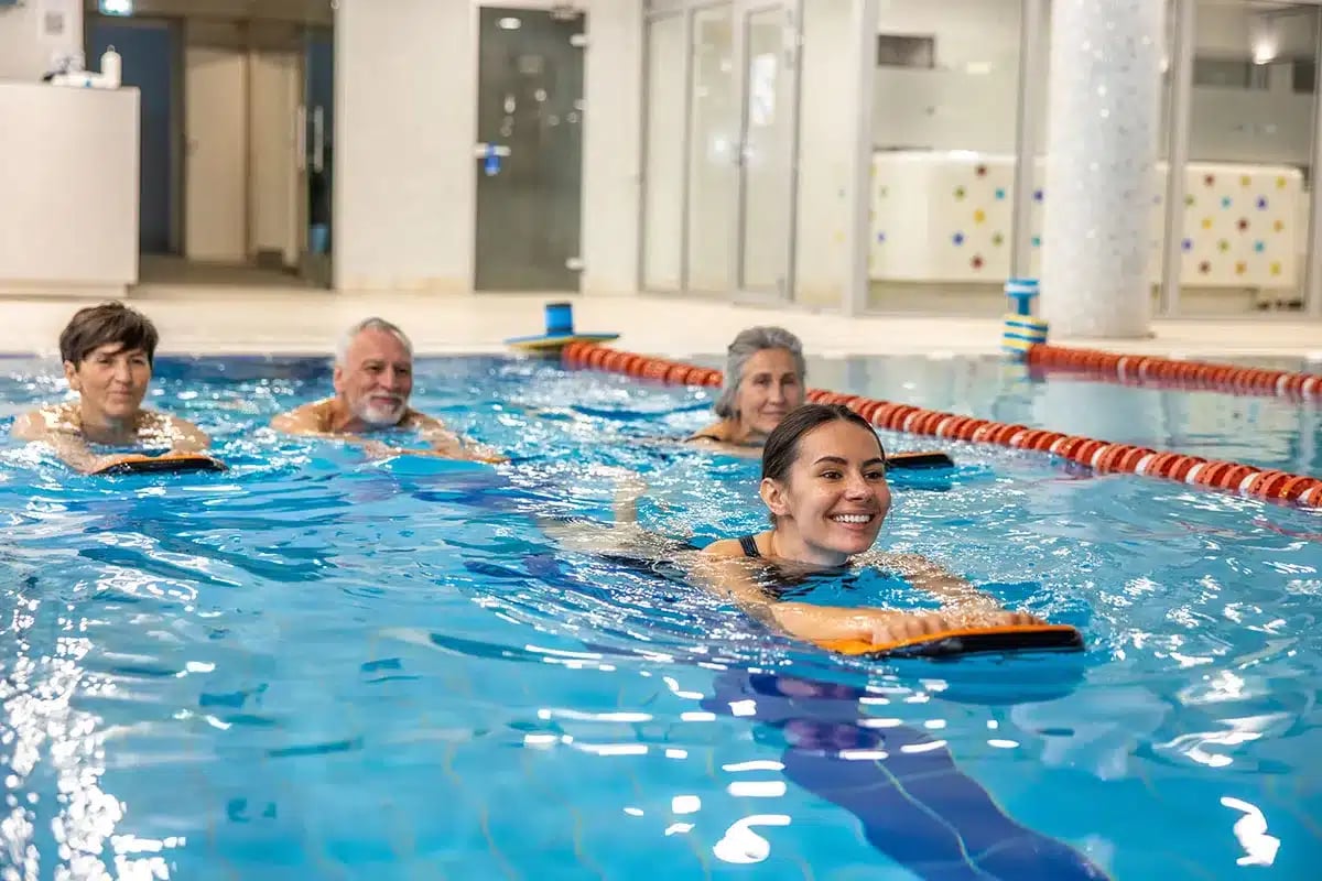 People doing water aerobics.