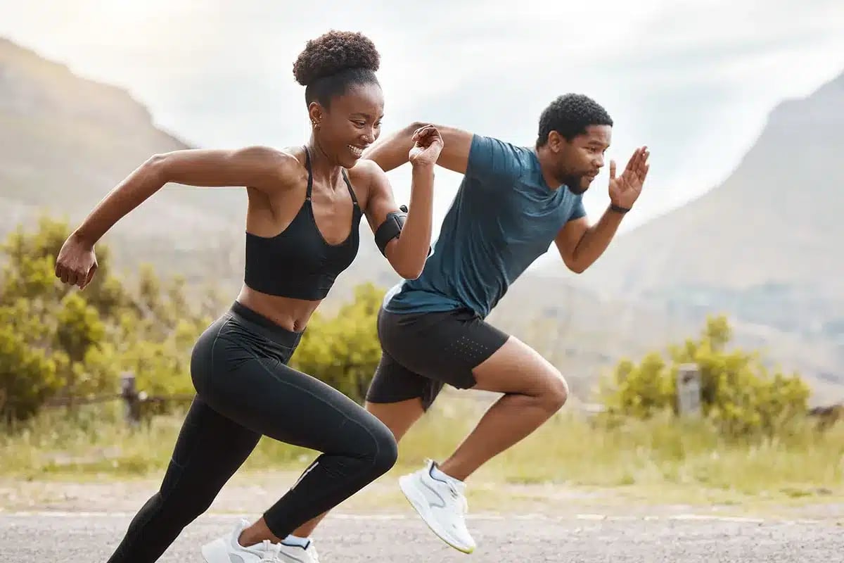 Couple running outdoors.