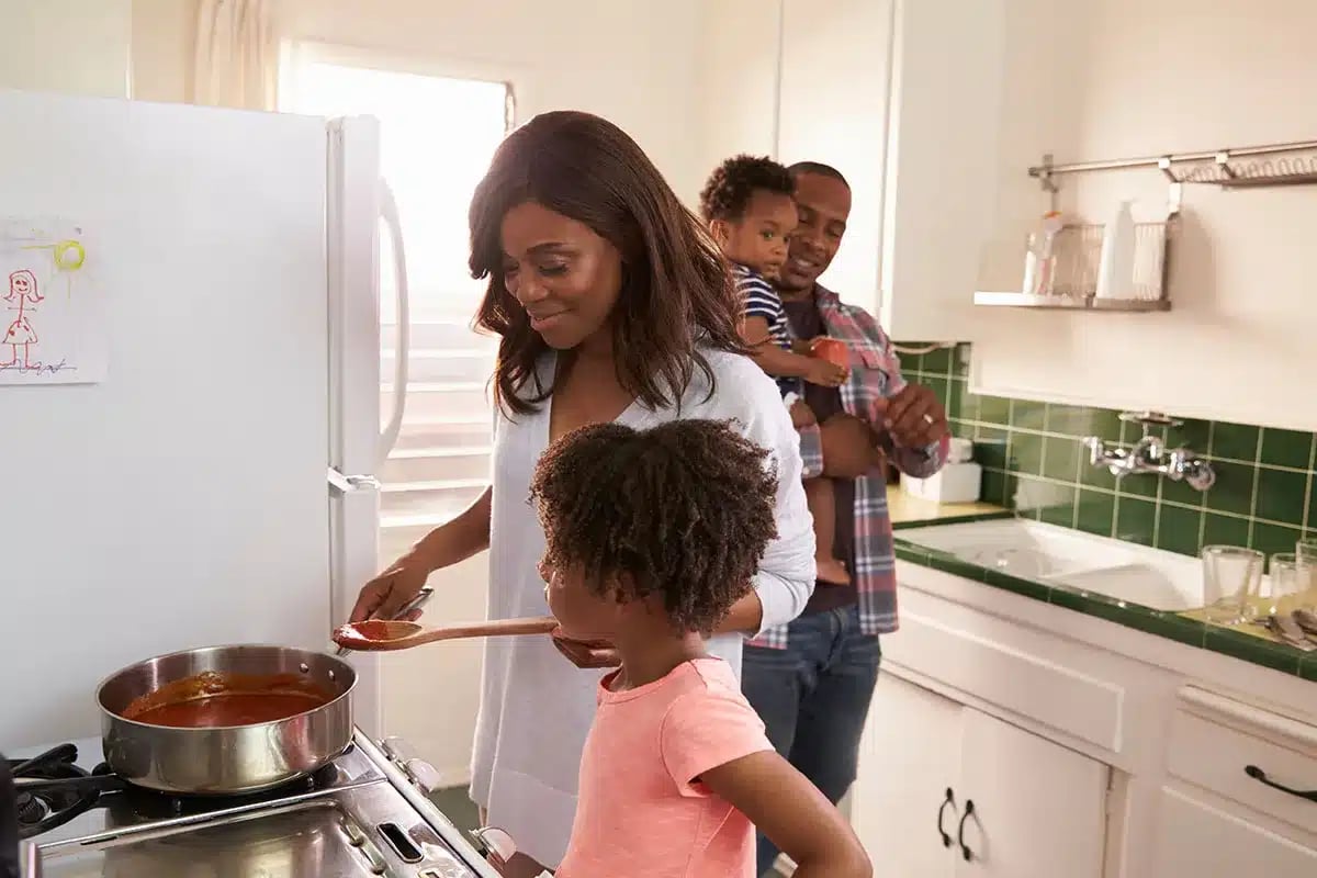 Happy family cooking in the kitchen.