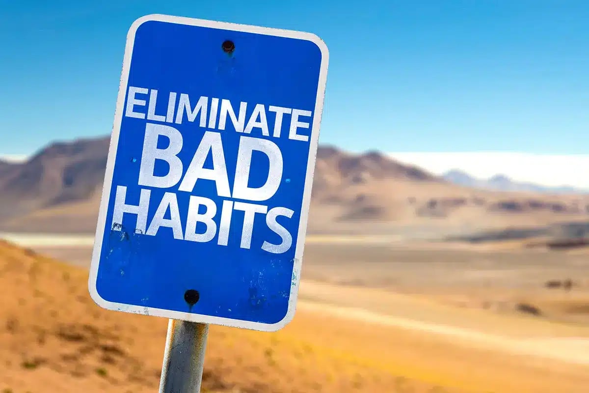Motivational sign about breaking bad habits.