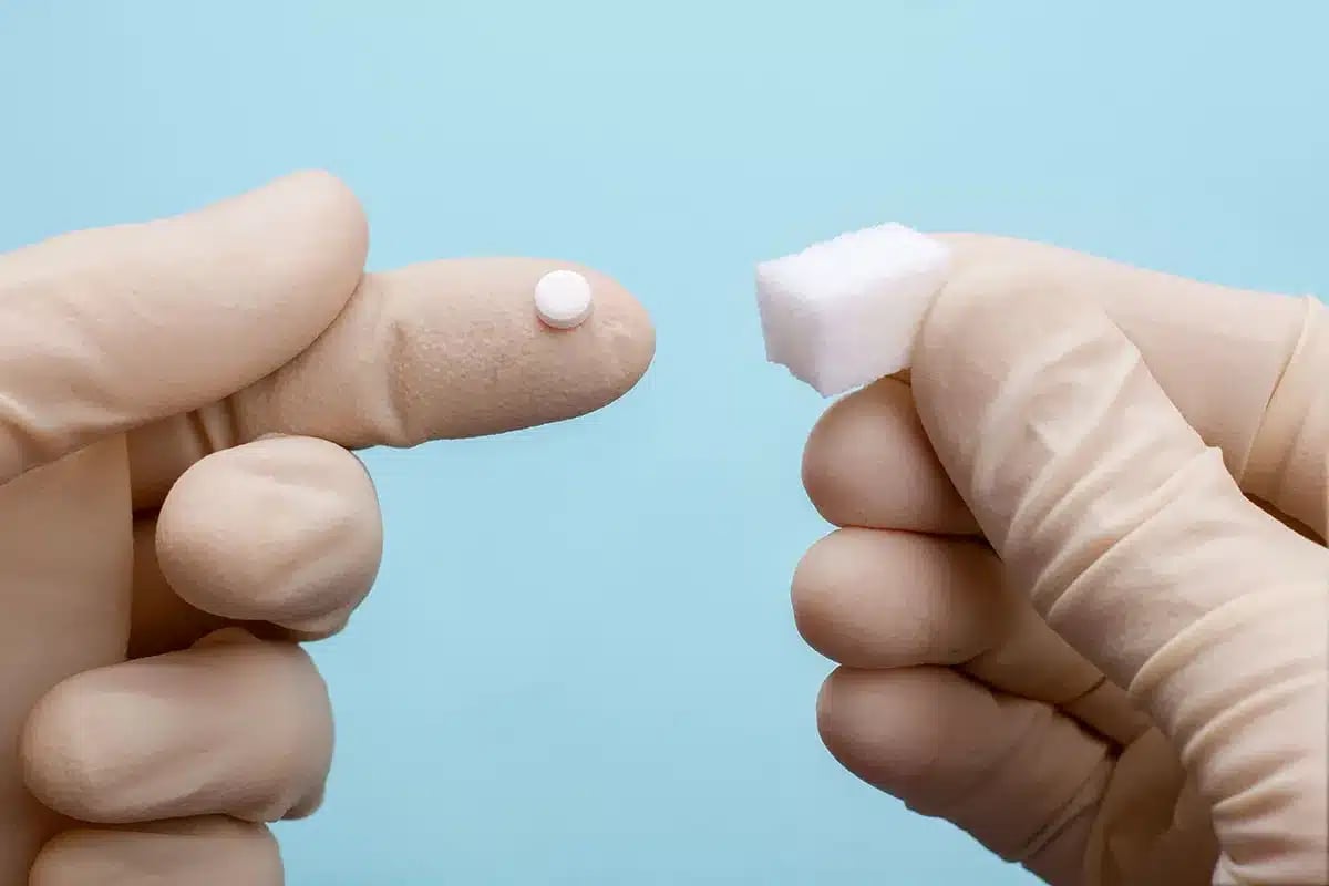 Sugar cube and sugar substitute comparison.