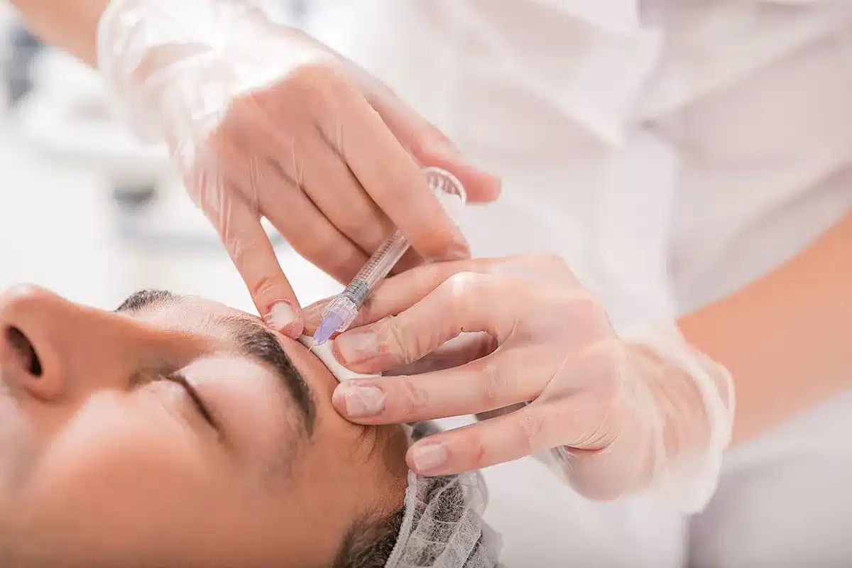 Close-up of botox injection procedure.