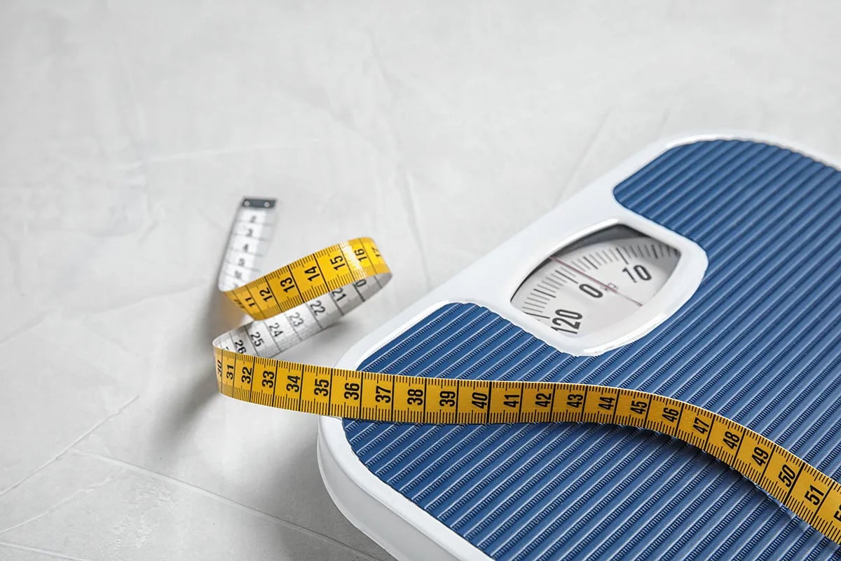 Bathroom scale and measuring tape.