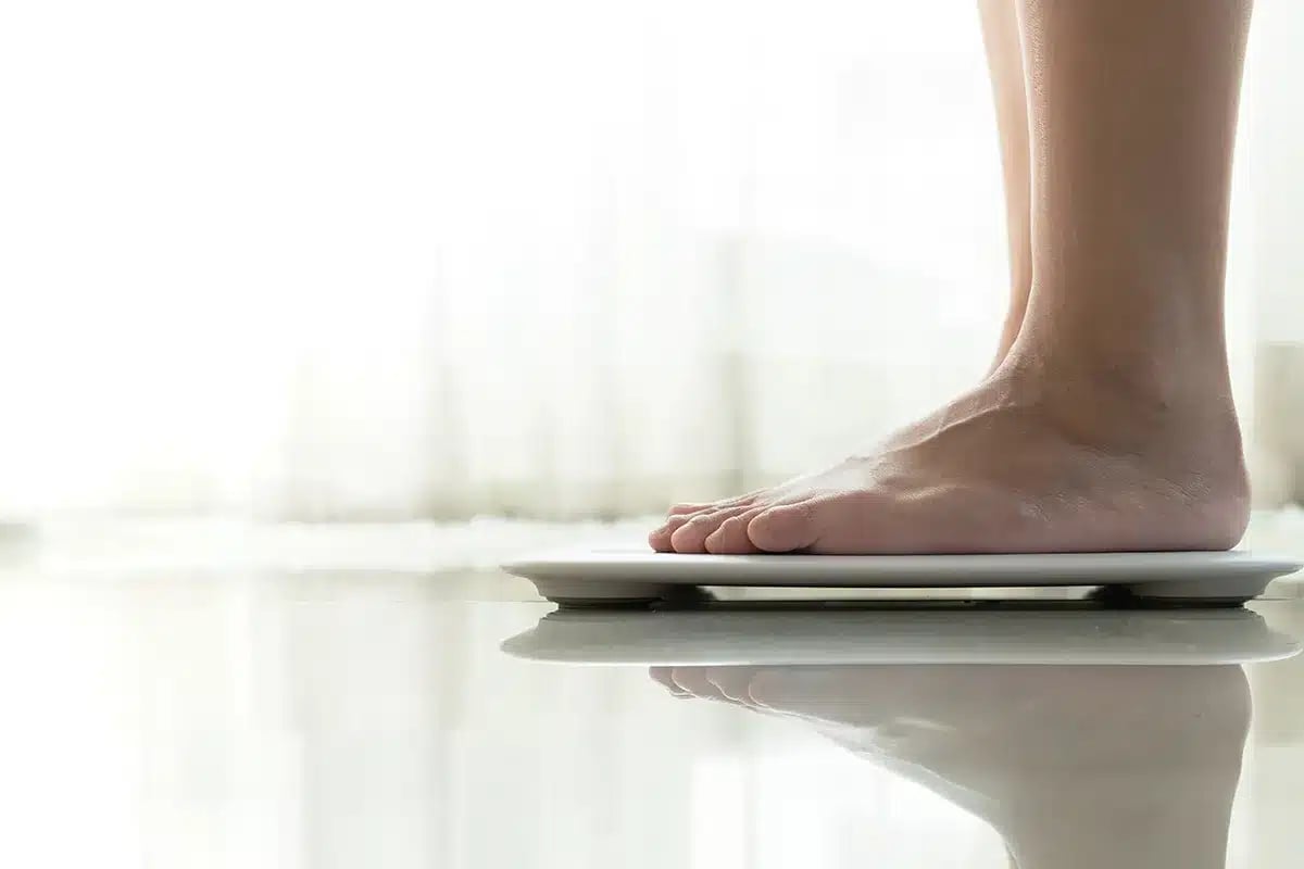 Person standing on a scale.