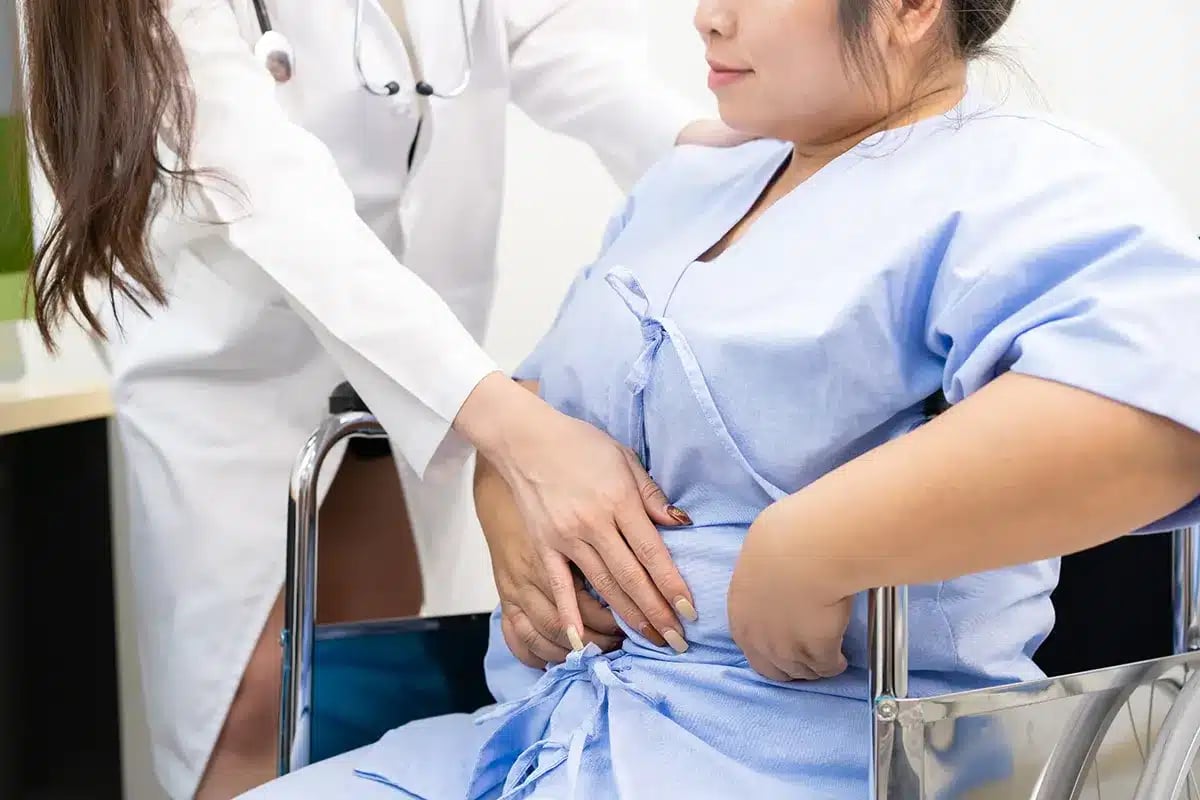 Doctor examining overweight patient.