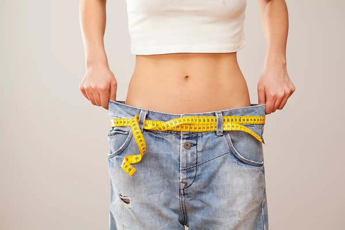 weight loss woman with bluejeans